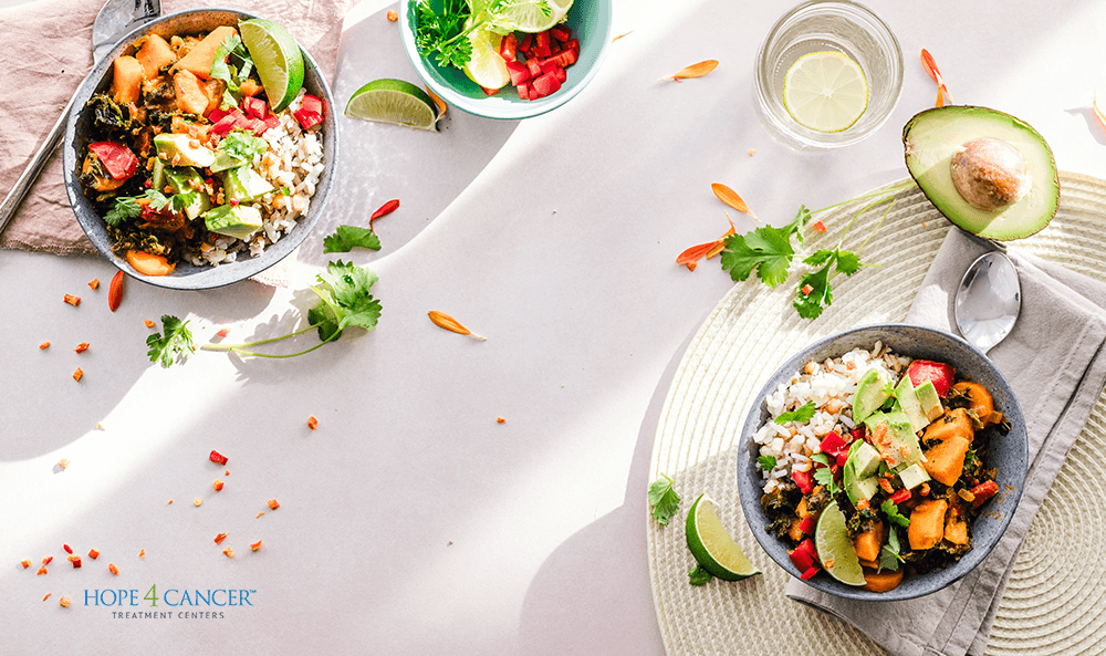 Organic food bowls on a table with avocados