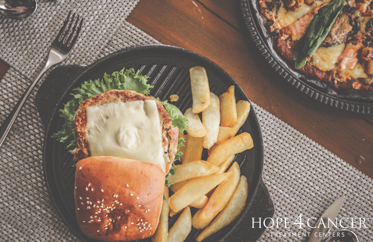 Hamburger and French fries on a plate