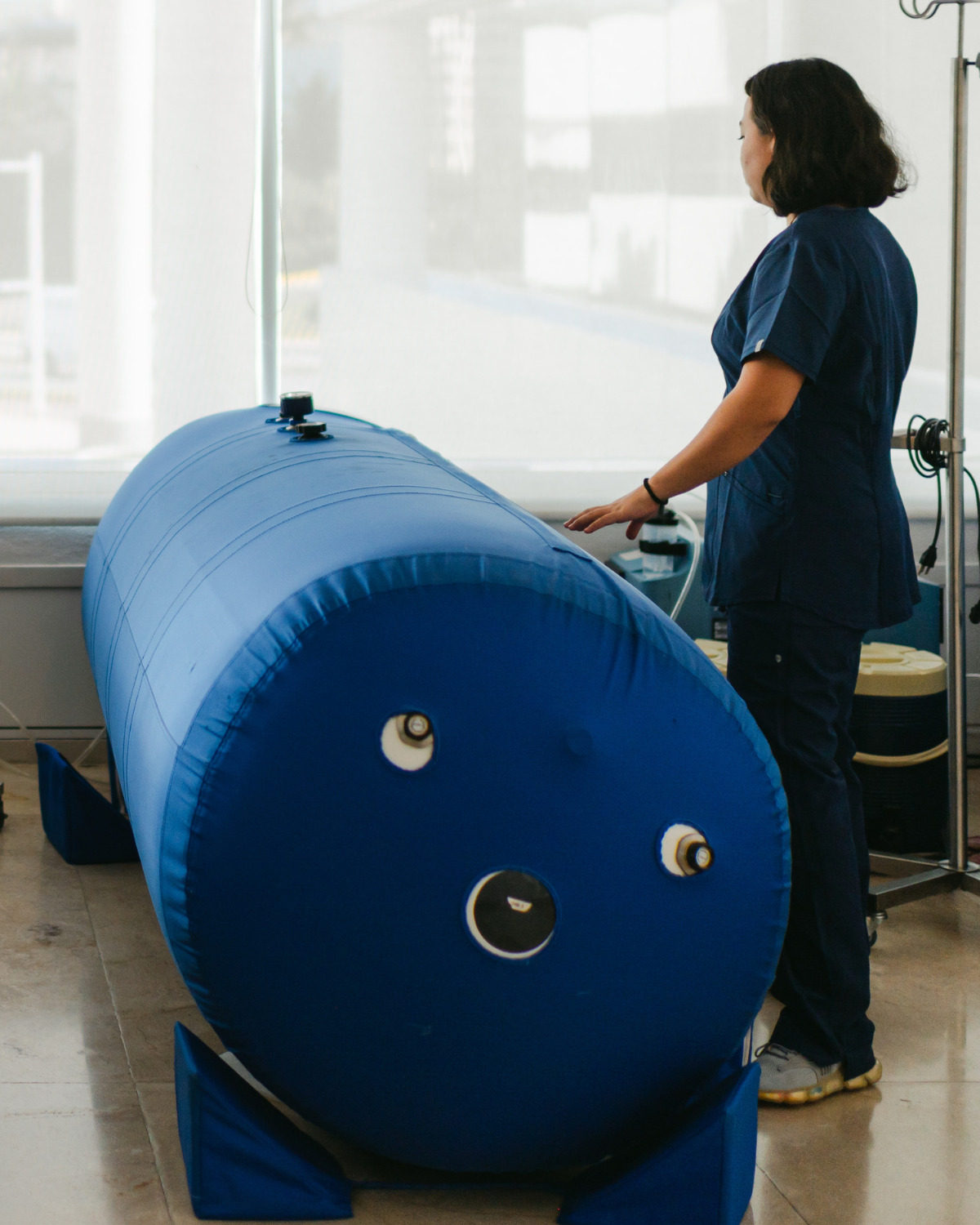 a photo of a nurse at a hyperbaric chamber